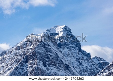 Closeup of snowcapped Haddo Peak mountain top as viewed from Morant's Curve at Lake Louise in Banff National Park, Alberta, Canada. Royalty-Free Stock Photo #2441706263