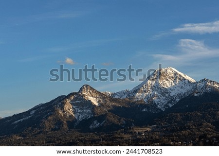 Austrian Alps in spring, Karawanken ridge in Carinthia at sunset Royalty-Free Stock Photo #2441708523