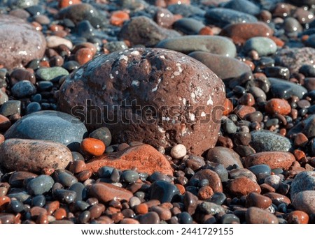 Close up picture of wet colored Lake Superior beach rocks