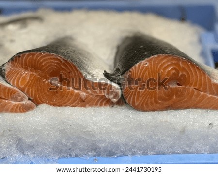 Salmon on ice close-up. Fresh fish on ice in a supermarket.
