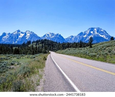 Teton Park Road and Mount Moran and Teton Range in Grand Teton National Park : WY, USA Royalty-Free Stock Photo #2441738183