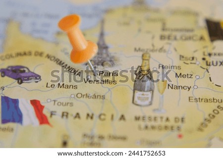 Tourist map of the city of Paris in France, in travel concept, with a push pin