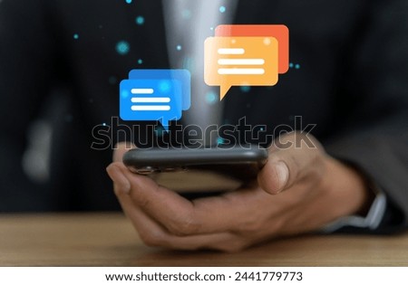 Human hand using smartphone typing Live chat chatting and social network concepts, chatting conversation working at home in chat box icons pop up. Social media marketing technology concept	