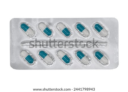 Macro shot pile of tablets pill in silver blister packaging isolated on white background. Aluminium foil blister pack. Pharmacy products. Medicine pills and drugs close up. Pills background Royalty-Free Stock Photo #2441798943