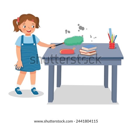 Cute little girl cleaning table with feather duster
