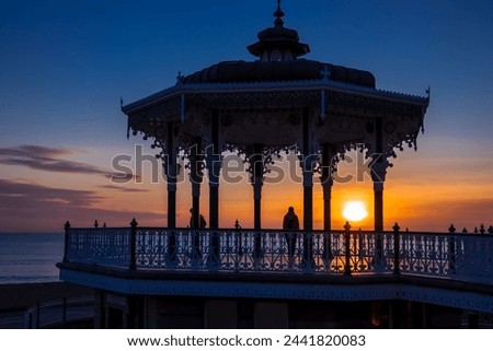BRIGHTON, EAST SUSSEXUK - JANUARY 26 : View of the sunset from a bandstand in Brighton East Sussex on January 26, 2018. Unidentified people. Royalty-Free Stock Photo #2441820083