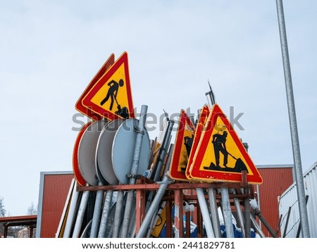 traffic signs on an outdoor storage area