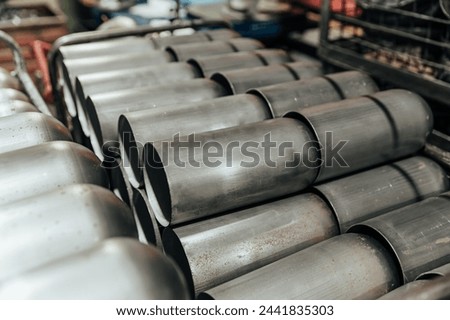 stacked metal cylinders in industrial factory