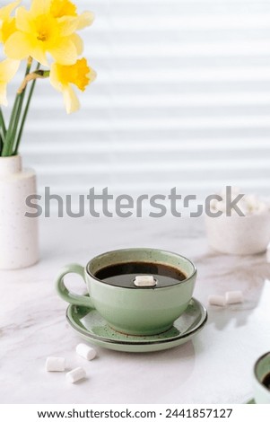 cup of coffee on the table, spring atmosphere, space for text