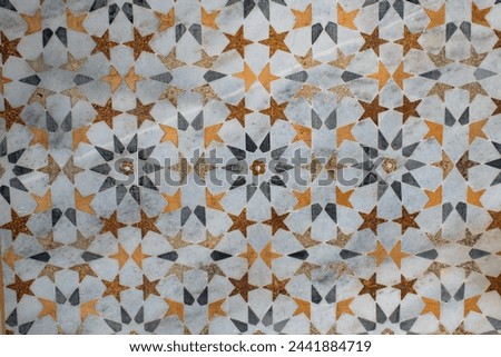 Beautiful marble inlay work. Pietra Dura inlay art technique used to build Taj Mahal, consists of Floral or Calligraphic inlays. Artwork of Taj Mahal is purely handmade by the highly skilled artisans. Royalty-Free Stock Photo #2441884719