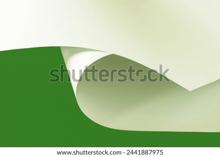 Sheets of A1 paper on a green background.