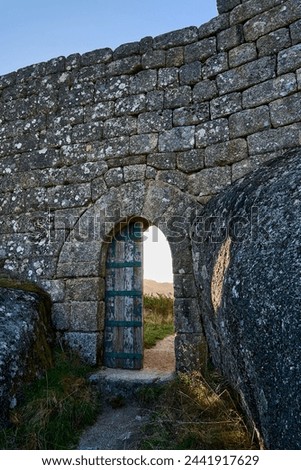 old wooden door of the gate to the medieval Castle Ruins of Castro Laboreiro in the mountains of northern Portugal inside Geras national park.