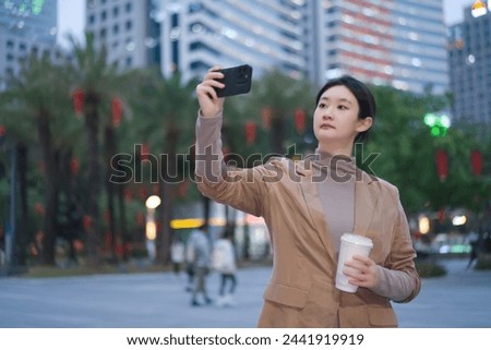 City Life Self-Portrait: Young Woman with Smartphone