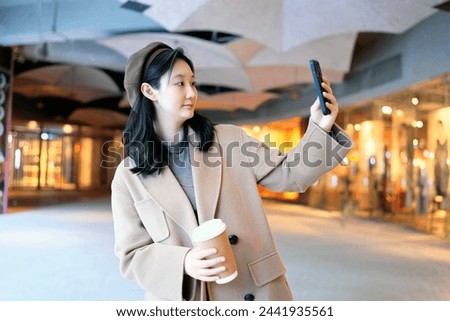 Young Woman Taking a Selfie in Urban Evening