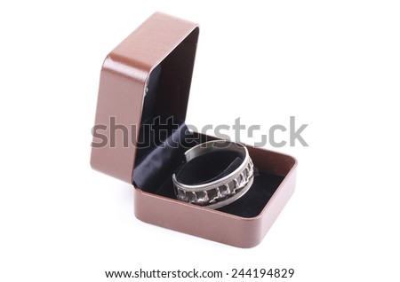 Silver gold jewelery in brown gift box on white background