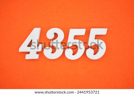 Orange felt is the background. The numbers 4355 are made from white painted wood.