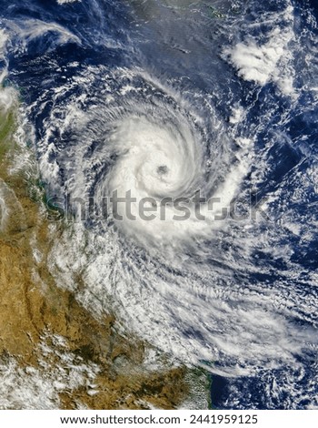 Tropical Cyclone Larry. . Elements of this image furnished by NASA. Royalty-Free Stock Photo #2441959125