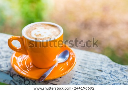 Coffee cup on wooden table - Vintage effect style pictures.