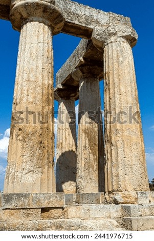 The archaic temple of Apollo, in ancient Corinth, Greece. It was built with monolithid doric columns, around 530 BC. Royalty-Free Stock Photo #2441976715