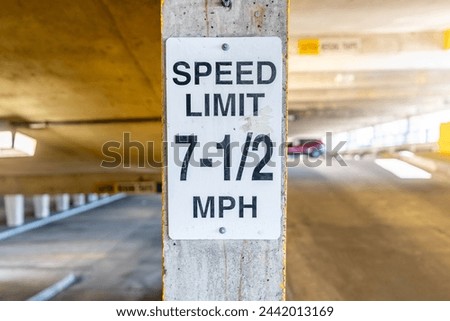 Odd 7.5 MPH speed limit sign within a parking garage.