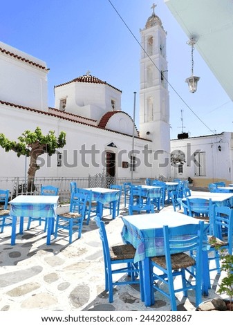 Photo of a traditional Greek tavern outside the Church of Virgin Malamatenia on the Cycladic island of Tinos, Greece.