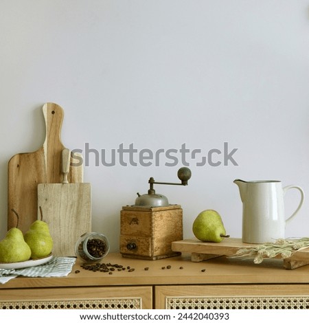 
Interior design of kitchen space with rattan commode,  ladder, cutting board, baking, coffee grinder food and kitchen accessories. Home decor.  Template. 