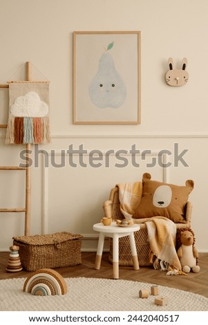 Cozy ids room interior with mock up poster frame, plush toys, brown pillow, braided armchair, round stool, ladder with ornament, beige wall with stucco and personal accessories. Home decor. Template.