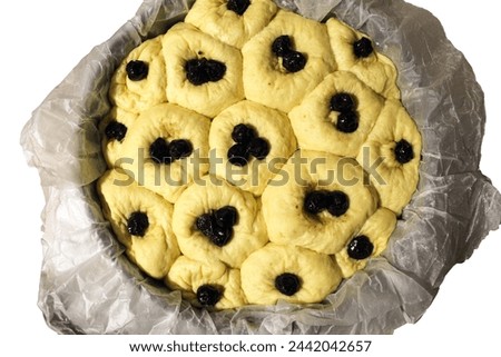 Pie with cherries on a white background. A product made from raw dough before baking. Home cooking stock photo in best quality.