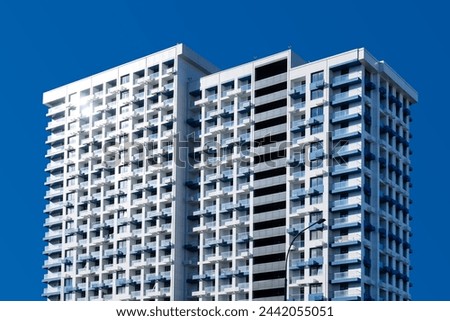 Multi-storey apartment building. New residential complex in the city of Sochi. A large modern multi-storey building in the resort city of Sochi. Royalty-Free Stock Photo #2442055051