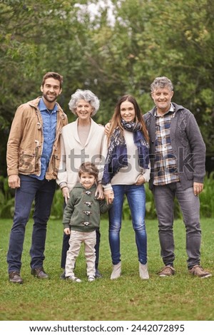 Family, grandparents and parents with child in portrait for bonding, happiness and picture in park. Outdoor, nature and old people with mother or father and kid for weekend or holiday together