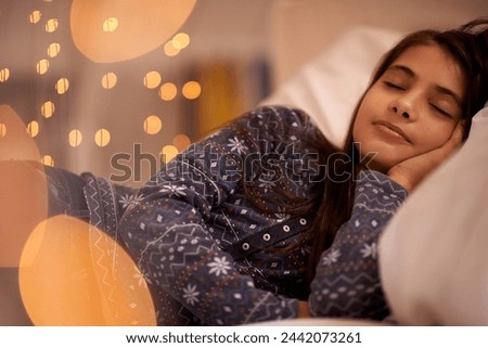 Child, sleeping and bed for dream, tired and rest for young and growing up for adolescent indoor. Girl or kid with pajamas and laying with pillow for exhausted in house for peace and calm on bokeh Royalty-Free Stock Photo #2442073261
