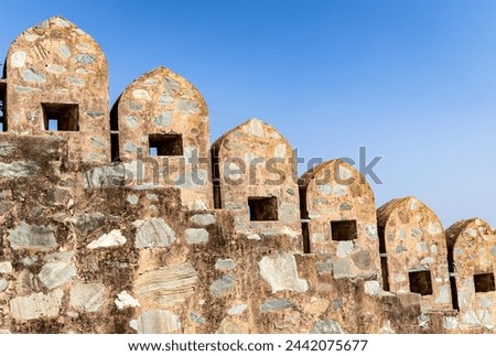 isolated ancient fort stone wall unique architecture with bright blue sky at morning image is taken at Kumbhal fort kumbhalgarh rajasthan india.