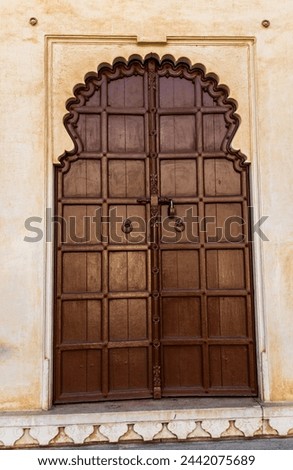 artistic wood door of ancient fort at morning image is taken at Kumbhal fort kumbhalgarh rajasthan india.