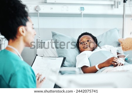 Clipboard, doctor and child in bed at hospital for recovery of surgery, illness or medical diagnosis. Healthcare, consultation and female pediatrician talking to African kid patient resting in clinic