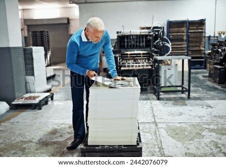Printing, factory and mature man with paper for quality control, design or product inspection. Warehouse, print workshop and person for logistics, manufacturing and industrial production in workshop Royalty-Free Stock Photo #2442076079