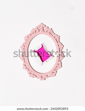 Crack in the wall, neon pink wallpaper background, oval vintage frame, creative wall decoration, retro aesthetics.