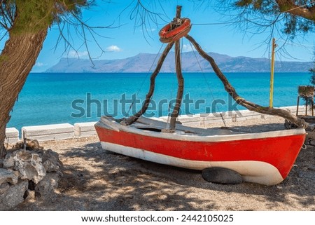 Second life of old fishing boat in Kissamos. Crete, Greece Royalty-Free Stock Photo #2442105025
