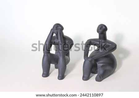 Two 7,000 old statuettes - The Thinker of Hamangia and The Seated Woman of Cernavoda - that seem so actual! Royalty-Free Stock Photo #2442110897