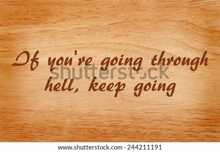 Inspirational quote by Winston Churchill on wooden grunge background, motivational background