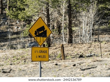 Highway sign that reads, "6% Grade for 6 Miles."