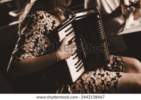 Playing the accordion. Close up.