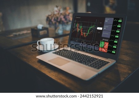 Technical price graph and indicator, red and green candlestick chart and stock trading computer screen background.planning and strategy, Stock market, trader or investor working at home Royalty-Free Stock Photo #2442152921