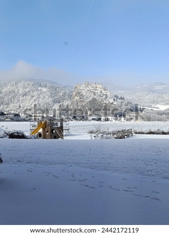 A winter landscape of a castle in Austria