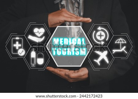 Medical tourism concept, Businesswoman hands holding medical tourism icon on virtual screen.