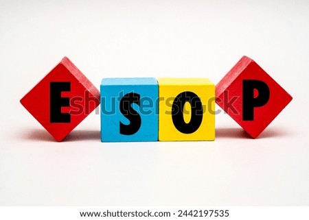 A coloured wooden block with word  “ESOP” on it. ESOP stands for “Employee Stock Ownership Plan”