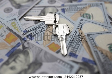 Conceptual photograph of a property keys on dollar bills
