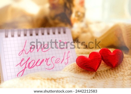 Love Yourself text on card. Inspirational phrase. Love and take care yourself concept. 