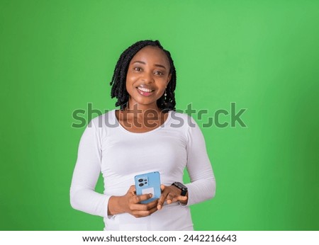 Young woman pressing a phone on isolated background