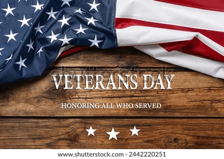 Veterans day. Honoring all who served. American flag on wooden background, top view