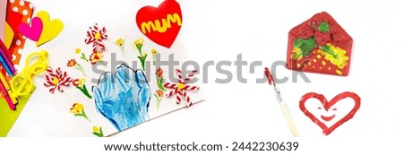 Child creating homemade greeting card. Paper crafts with bouquets of flowers and hearts, gift for Mothers day, Birthday or Valentines day . Arts crafts concept. Preshool crafts. Banner